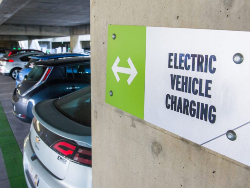 a sign that reads "electric vehicle charging"