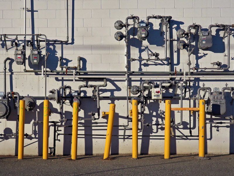 Natural gas pipes on a wall.