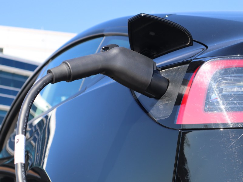 An electric vehicle is plugged in and charging.