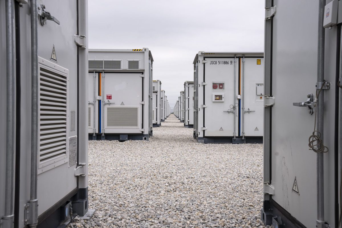 An array of large utility-scale batteries the size of storage containers at a facility in Texas.