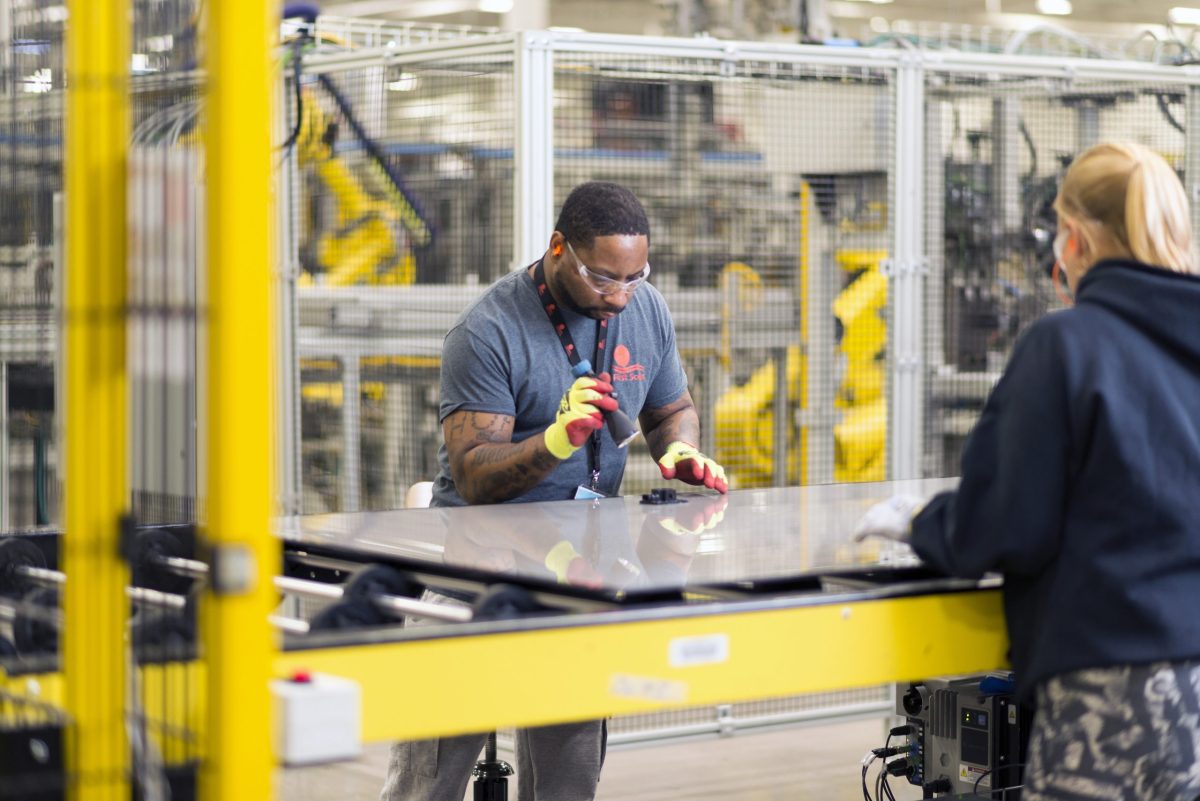 Crew members perform an inspection at one of First Solar’s Ohio manufacturing plants.