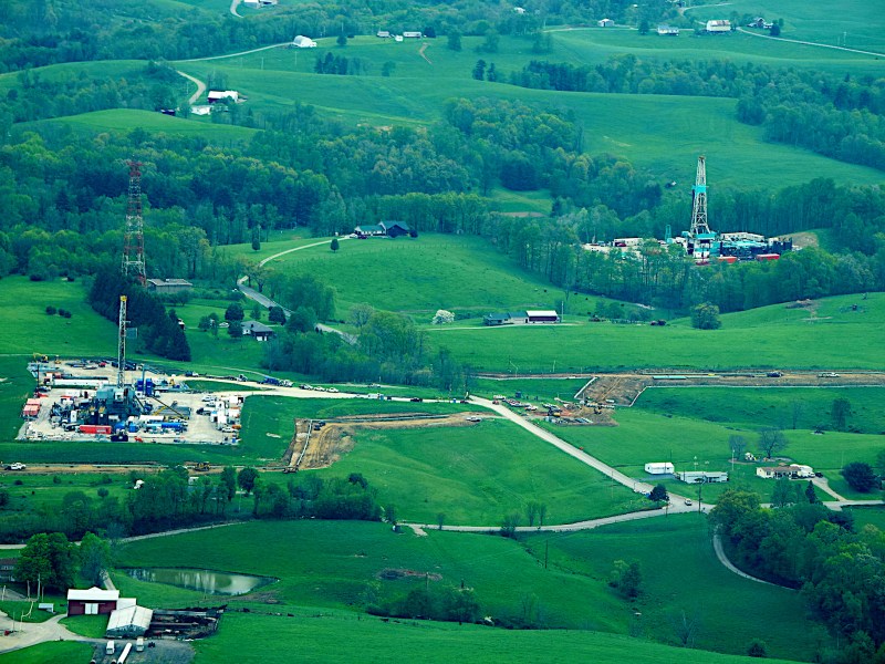 Drilling rigs alongside homes in Malaga Township, Ohio.