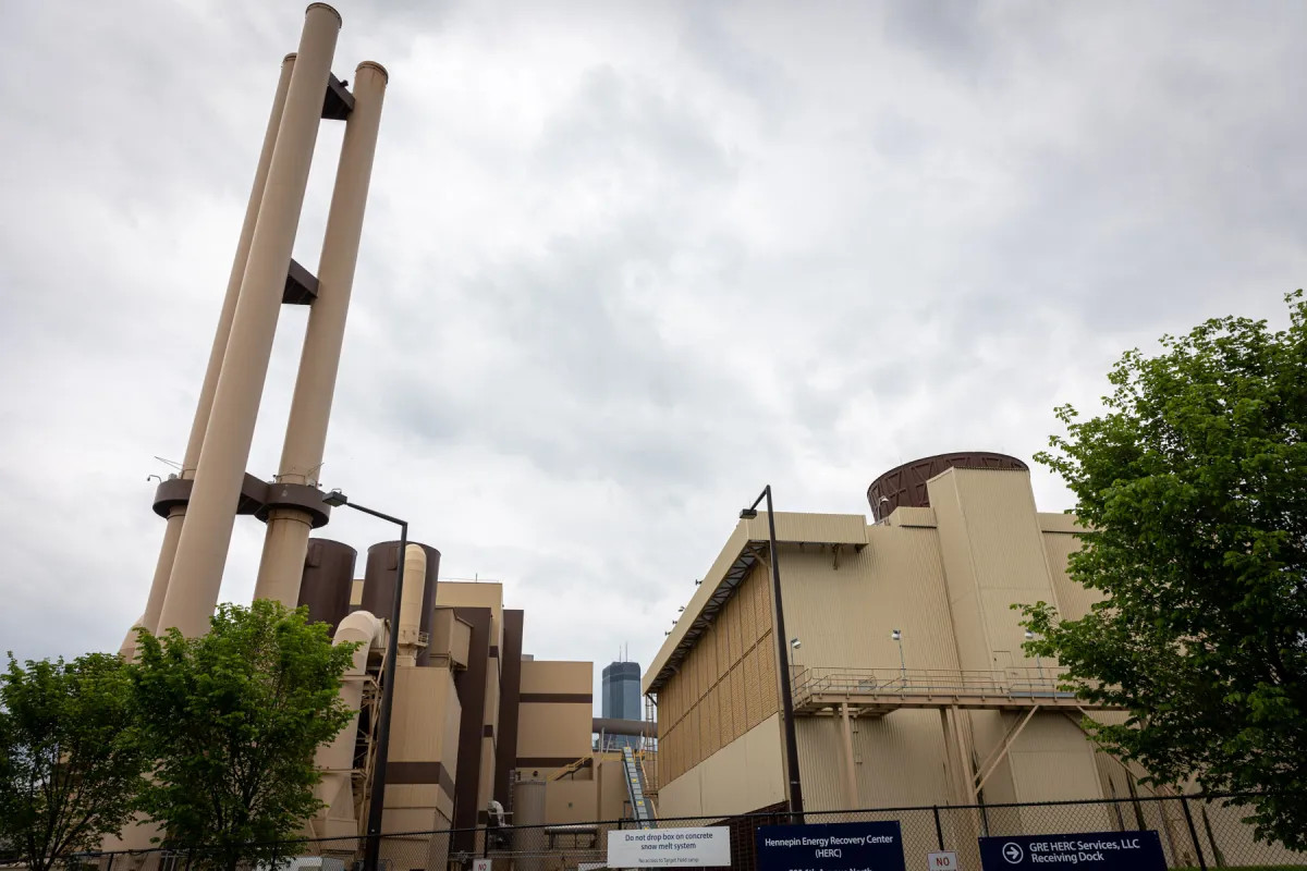 A photo of a waste-to-energy plant in Minneapolis with a cloudy sky in the background