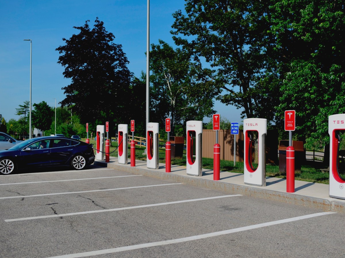 An electric vehicle charging station in Maine with one car and five empty stalls.