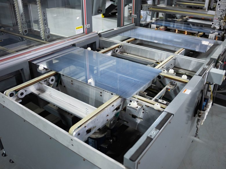 A conveyor system carries materials through 22 primary steps in Toledo Solar’s manufacturing process.