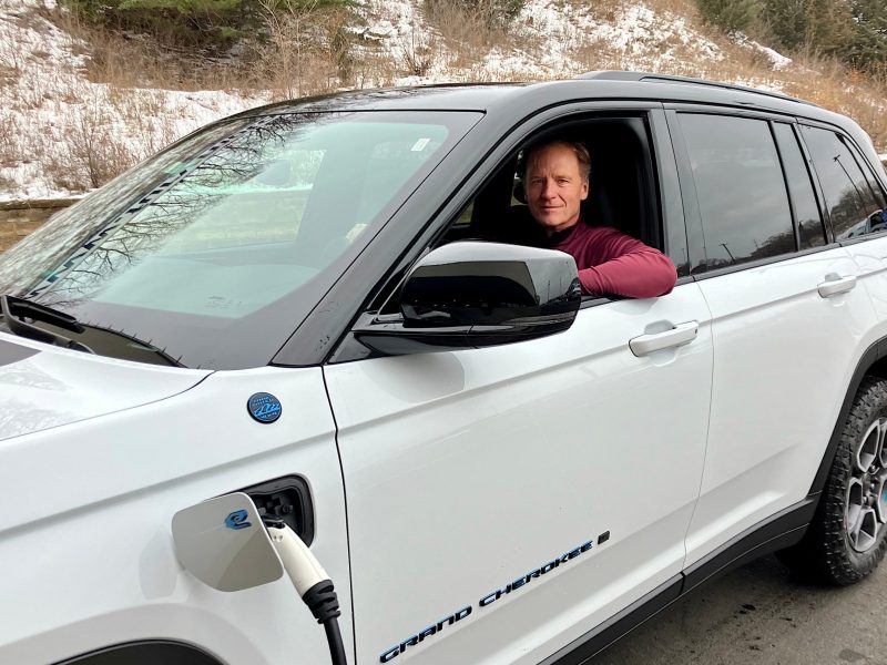 Tom Leonard, incoming chair of the Minnesota Automobile Dealers Association, charges a plug-in hybrid Jeep Grand Cherokee at Fury Motors in South St. Paul.